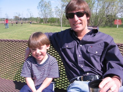 Jessica took this picture of Christopher & Joe (March 25, 2006)<br>
Leah is in the background, wearing the red shirt, tossing practice pitches to girls<br>
who are playing softball with Samantha before the Big Game.