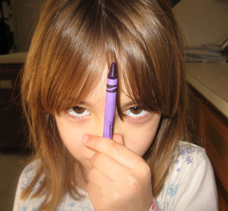 Jessica and Purple Crayola. Picture taken by her sister, Samantha. (December 2005)