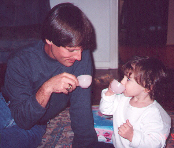Joe & Samantha having some tea at Grandma & Grandpa Ortego's house (Thanksgiving '99)
