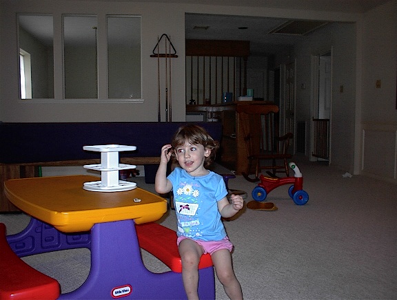 Samantha playing in her gameroom (2000)